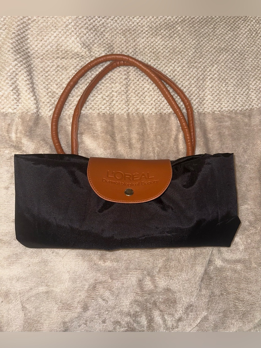 L’Oréal Dermatological Beauty Large Black and Brown Nylon Foldable Zip Tote Bag